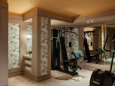 a fitness room with a gym with mirrors at The Editory Boulevard Aliados Hotel - Preferred Hotels in Porto