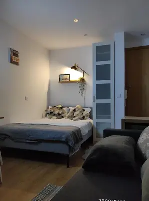 a bedroom with a bed with pillows on it at Porto Downtown Taipas in Porto