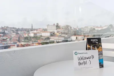a book sitting on a table on a balcony at GuestReady - Port Studio 2 in Vila Nova de Gaia
