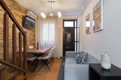 a living room with a couch and a table at Host Wise - Lovely & Cozy House - Prime Location in Vila Nova de Gaia