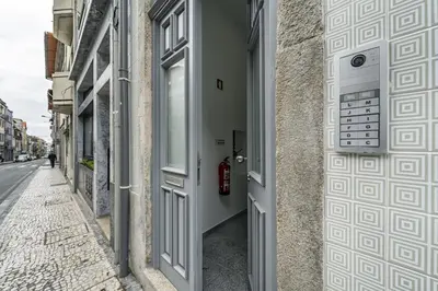 a door to a building with a phone at Nomad's Formosa - Apartments Porto in Porto