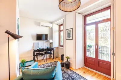 a living room with a red door at Josephine Apartments in Porto