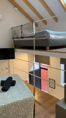 a room with two bunk beds and a table at Five House 14B in Porto