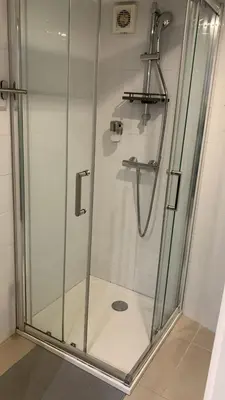 a shower with a glass door in a bathroom at Five House 14B in Porto