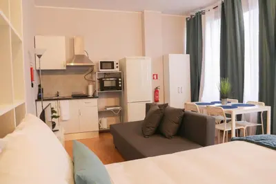 a living room with a couch and a table at Bonsai Apartment II in Porto