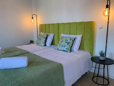 two beds sitting next to each other in a room at Lost Inn Porto Hostel in Porto
