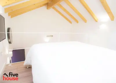 a living room with a white table in a house at Five House 14A in Porto