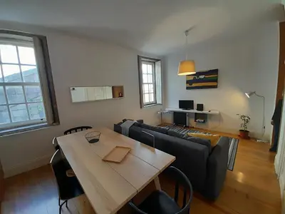 a living room with a couch and a table at Comfortable Central 2 Bedrooms Apartments by Great&Cosy in Porto