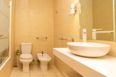 a bathroom with a sink and a toilet at Estúdio Encantador com vistas para o Douro Gaia in Vila Nova de Gaia