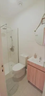 a bathroom with a toilet and a shower and a sink at Clérigos City Heart Flat in Porto
