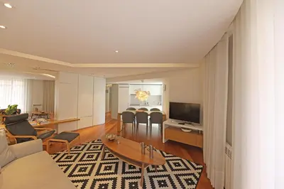 a living room with a couch and a table at FLH Sá da Bandeira Modern Apartment in Porto
