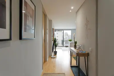 a hallway with a hallway leading to a room at Balconies of Cedofeita & Garage in Porto