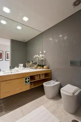 a bathroom with a sink and a toilet and a tub at Balconies of Cedofeita & Garage in Porto
