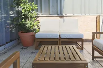 a pair of benches sitting on a patio at Marquês Deluxe Apartments 3 & 4 in Porto