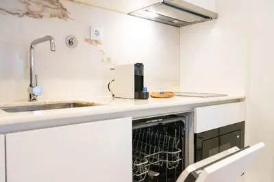 a kitchen with a dishwasher and a sink at N&N Home in Porto