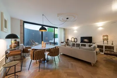 a living room with a couch and a table at Classy & Stylish Porto Duplex in Porto