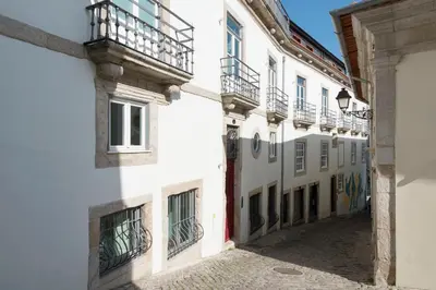 an alley in a town with white buildings at Classy & Stylish Porto Duplex in Porto