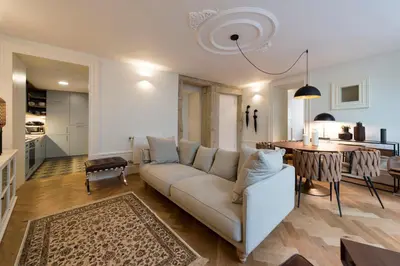 a living room with a couch and a table at Classy & Stylish Porto Duplex in Porto