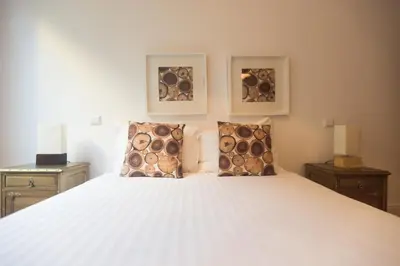 a bedroom with a white bed with two night stands at Citybreak-apartments Bolhao in Porto