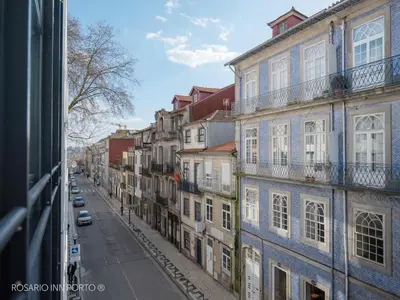 a view from a window of a street with buildings at rosario inn porto in Porto
