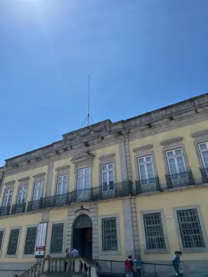 a building with a flag on top of it at Porto Legend Apartments in Porto