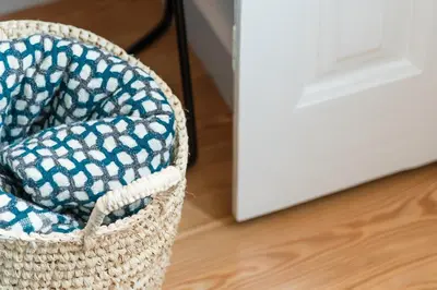 a basket sitting on a floor next to a door at GuestReady - Chakra Duplex in Porto