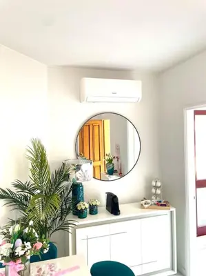 a bathroom with a mirror and a white counter at Apartamento Paradise Porto in Porto