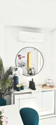 a room with a mirror and a table and chairs at Apartamento Paradise Porto in Porto