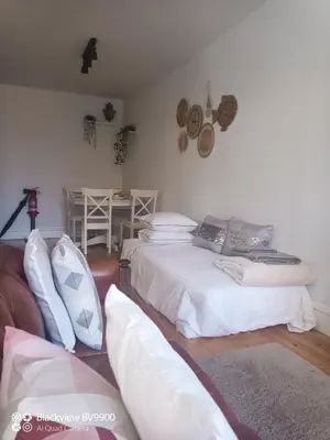 a living room with two beds and a couch at Oporto Apartment Sé Catedral in Porto