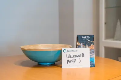 a bowl and a book sitting on a table at GuestReady - Final Step in Porto