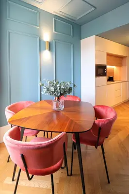 a dining room with a wooden table and red chairs at HM - Infante Riverside Apartment K in Porto