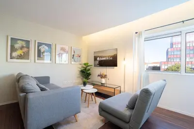 a living room with a couch and a chair at Host Wise - Restful Minimalist Flat - Balcony in Porto