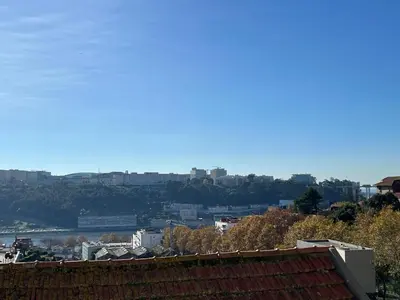 a view of a city with buildings in the distance at Duplex Apt - Sleeps 4 - Roof Terrace - Balcony in Porto