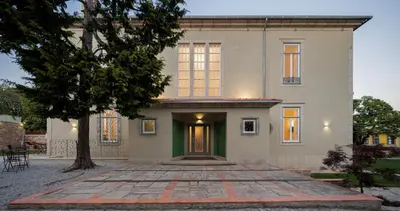 a house with a tree in front of it at Casa Kala in Porto