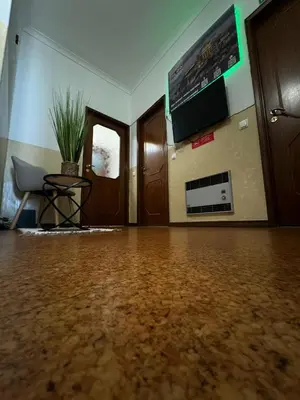 an empty room with a table and a tv on the wall at Pilar Hostel - Rua de Santa Catarina - Porto in Porto