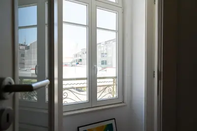 a window in a room with a view of a building at Belleville in Porto