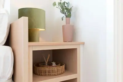 a shelf with a lamp and plants on top of a bed at Central Superb Flat w/ AC & Balcony by LovelyStay in Porto