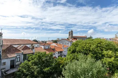 a view of a city with buildings and trees at ! Luminous 2BR Top Floor ! Praça da República in Porto