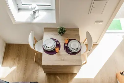 an overhead view of a dining room table with chairs at Casa do Bonjardim, Lapa - Estadia no coração do Porto in Porto