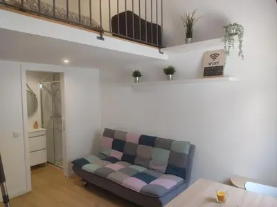 a living room with a couch and a table at Casa do Bonjardim, Lapa - Estadia no coração do Porto in Porto