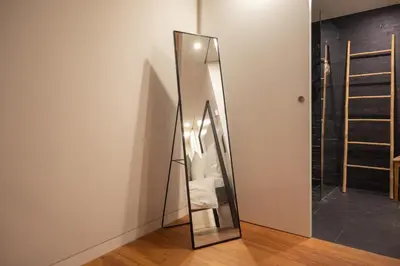 a mirror sitting on the floor in a room at Loungy Porto in Porto