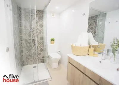 a white bathroom with a shower and a toilet at FIVE HOUSE 16 in Porto