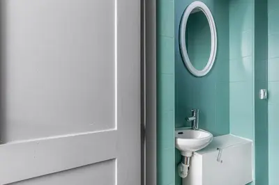 a bathroom with a sink and a mirror at GuestReady - Modern Comfort in Downtown in Porto