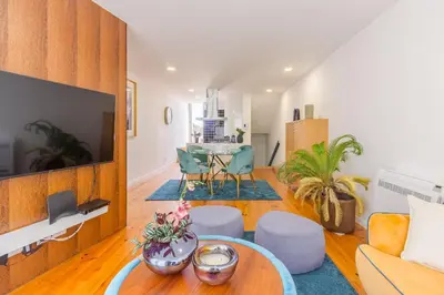 a living room with a couch and a table at OHH- Padre António Vieira flat D - 2bedroom near the train station in Porto