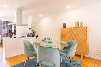 a dining room with a glass table and chairs at OHH- Padre António Vieira flat D - 2bedroom near the train station in Porto