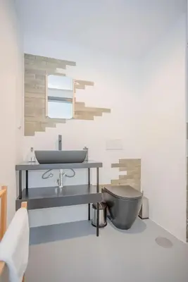 a bathroom with a sink and a toilet at Liiiving in Porto - City Design Studios in Porto