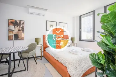 a room with a bed and a sign that says clean andslice at Liiiving in Porto - City Design Studios in Porto