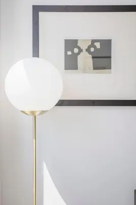 a white room with a lamp and a picture at Liiiving in Porto - City Design Studios in Porto