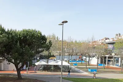 a street light with umbrellas in a park at FLH Gaia Wine Cellars Flat in Vila Nova de Gaia