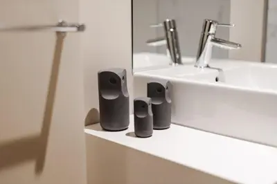 a bathroom with a sink and two speakers on a counter at City Luxury Apartment, Downtown Porto near Metro in Porto